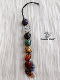 7 chakra stone hanging with tree of life charm on white background