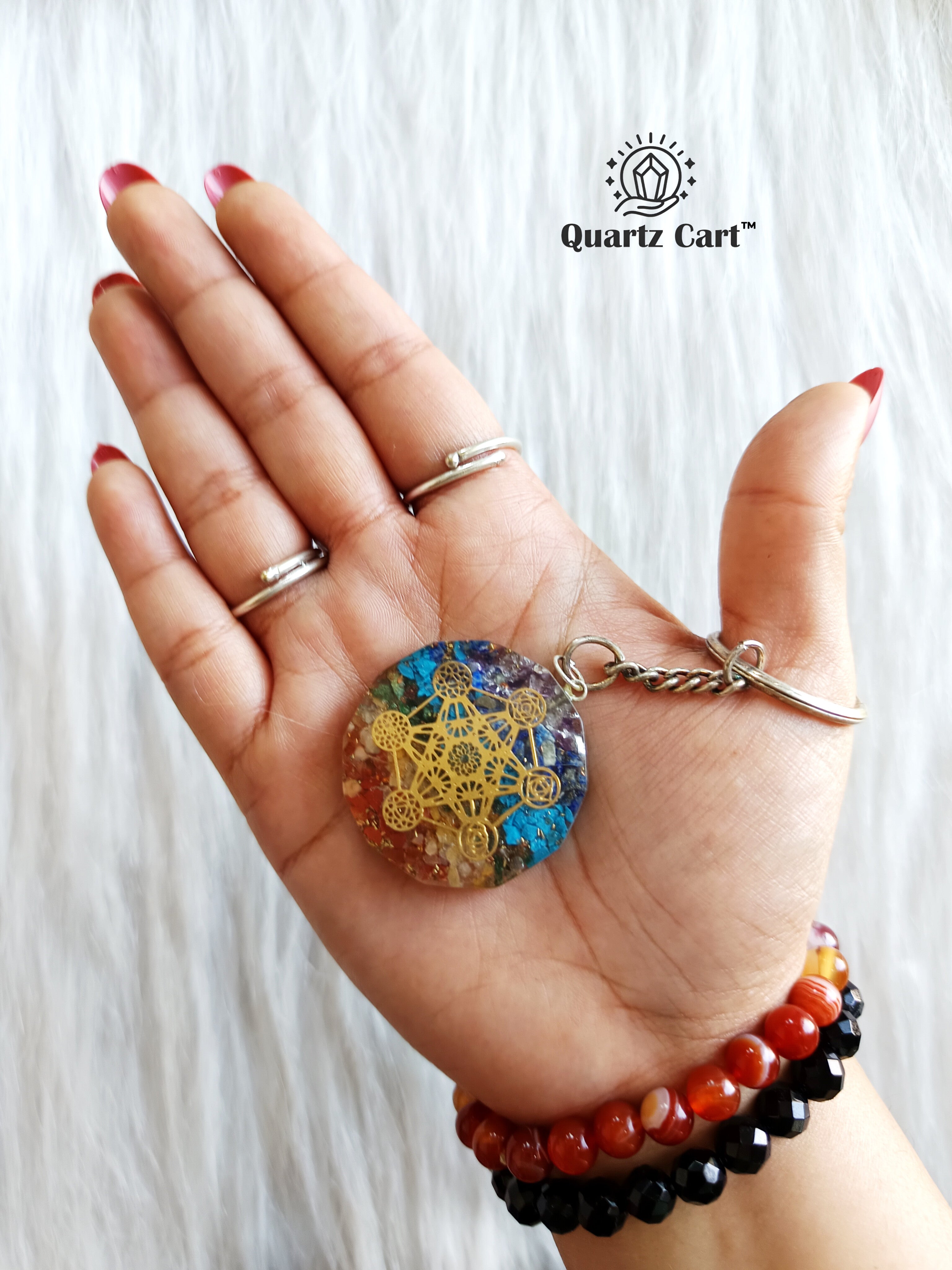 7 chakra orgone healing crystal keychain in hand
