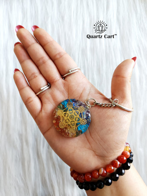 7 chakra orgone healing crystal keychain in hand