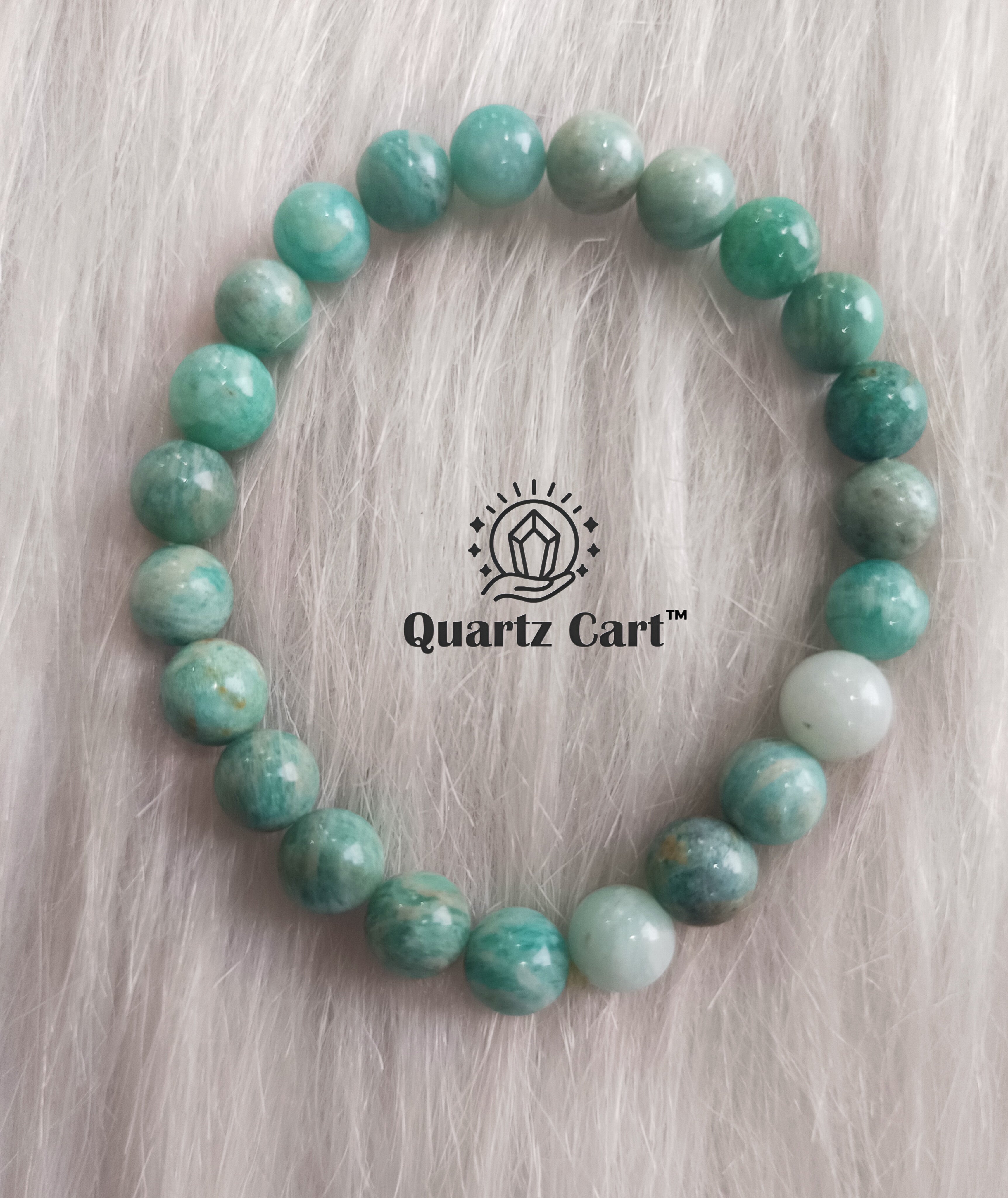 Amazonite bracelet held on hand showing natural green gemstone beads, healing crystal bracelet for calmness, balance and positive energy