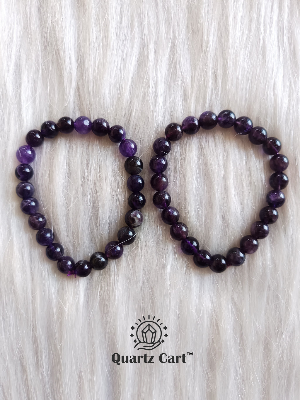 Hand wearing Amethyst round healing crystal bracelet for peace protection and emotional balance