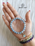 angelite charms bracelet worn on hand for calm peace and emotional healing