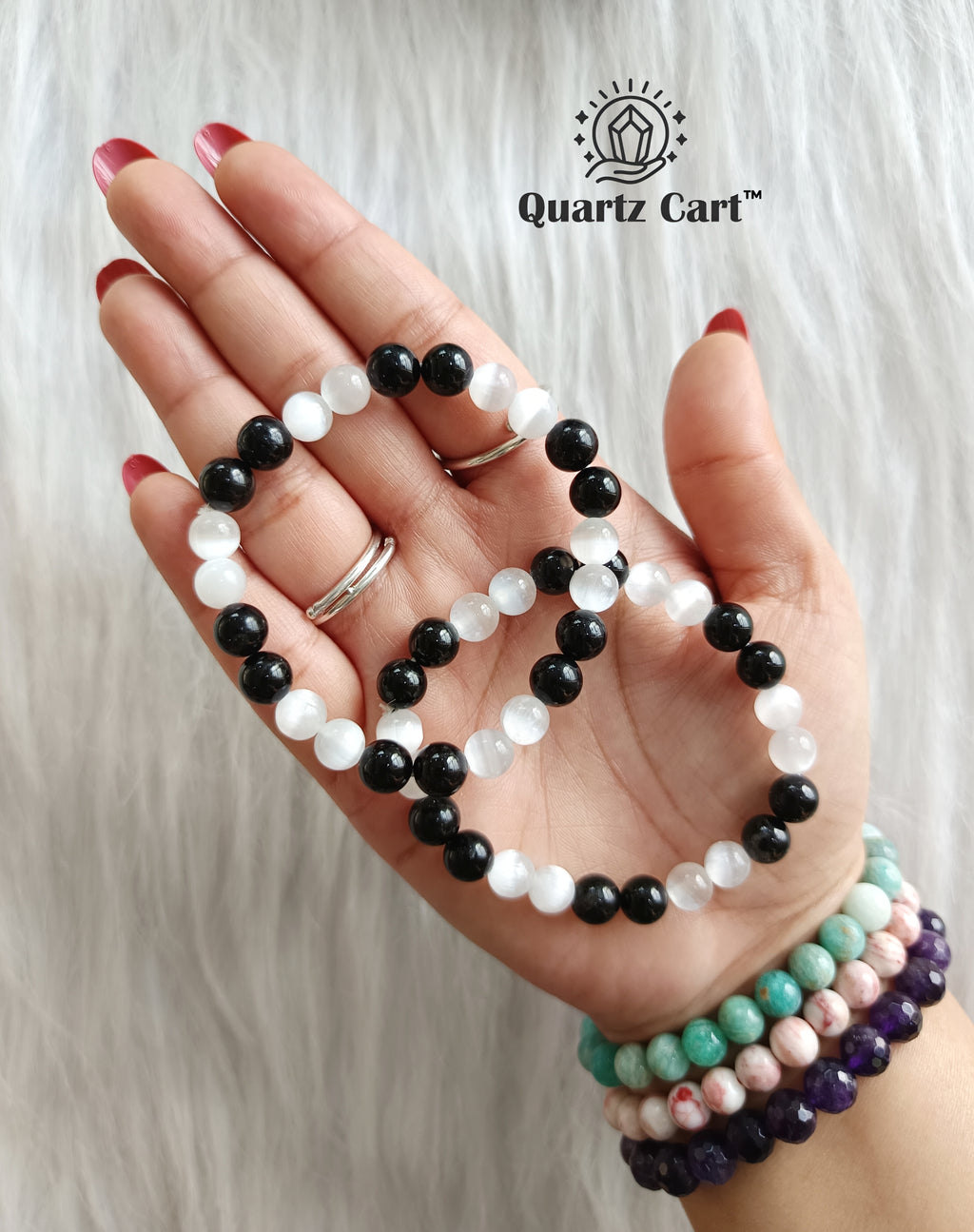 Women wearing black tourmaline and selenite aura cleanser bracelet for protection, grounding and energy cleansing
