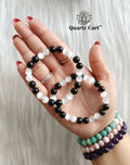 Women wearing black tourmaline and selenite aura cleanser bracelet for protection, grounding and energy cleansing