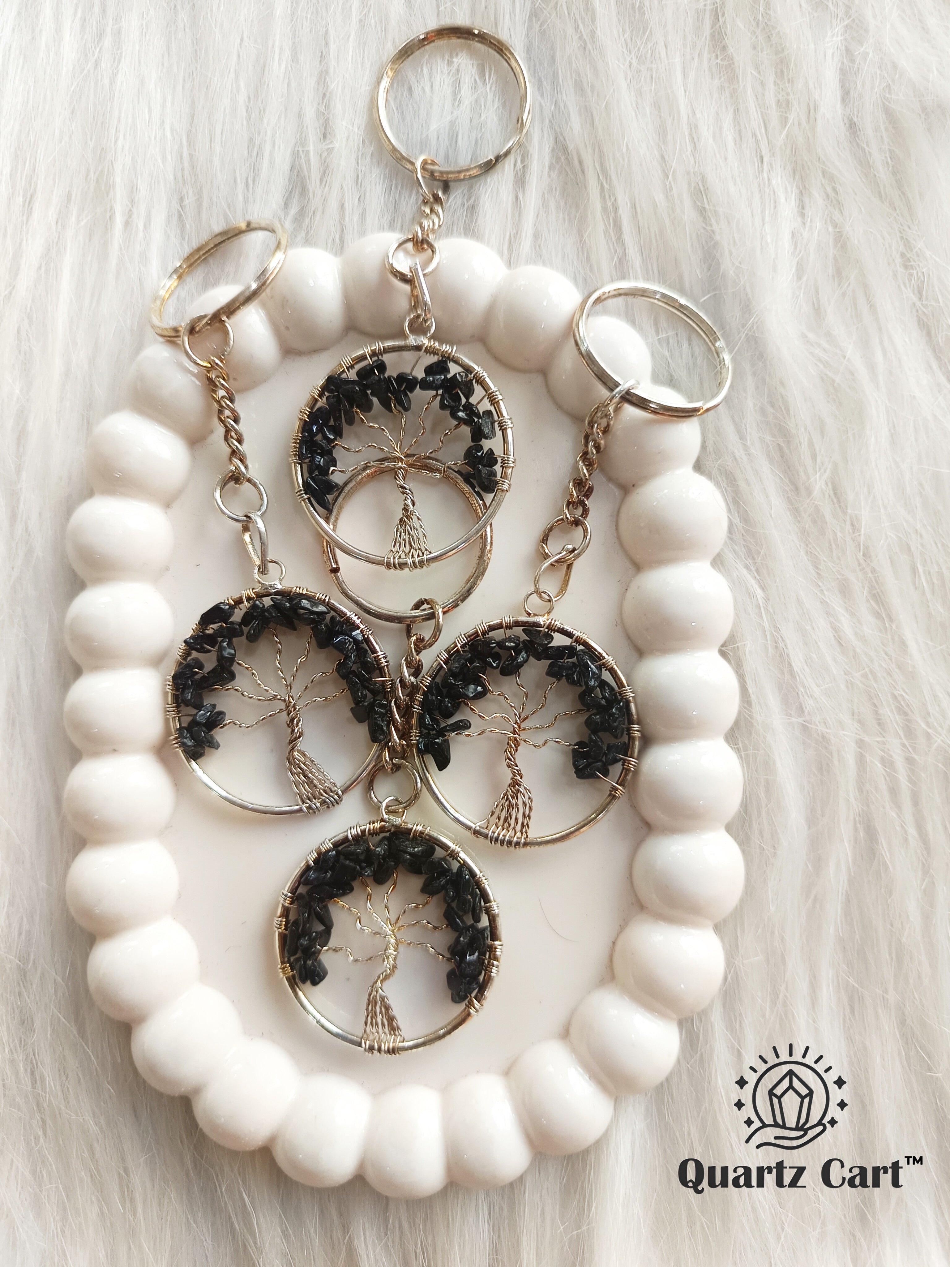 black round stone keychain with tree of life charm
