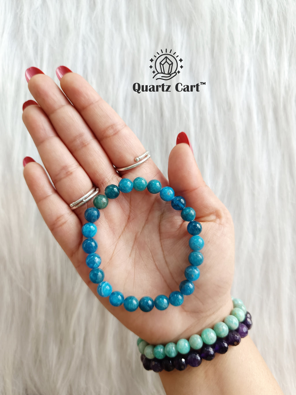 Blue Apatite bracelet on hand showing natural gemstone beads for clarity focus and manifestation energy