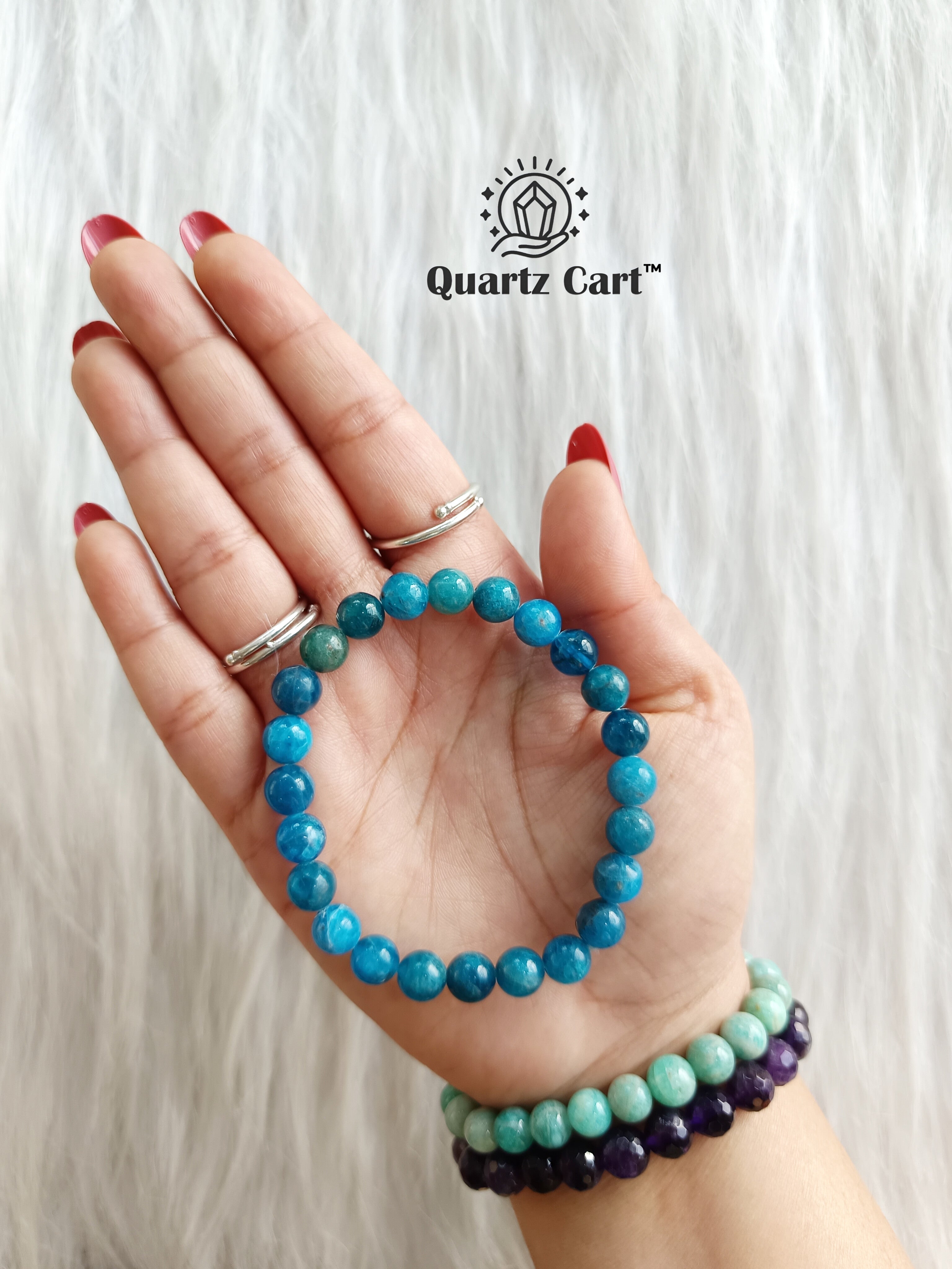 Blue Apatite bracelet on hand showing natural gemstone beads for clarity focus and manifestation energy