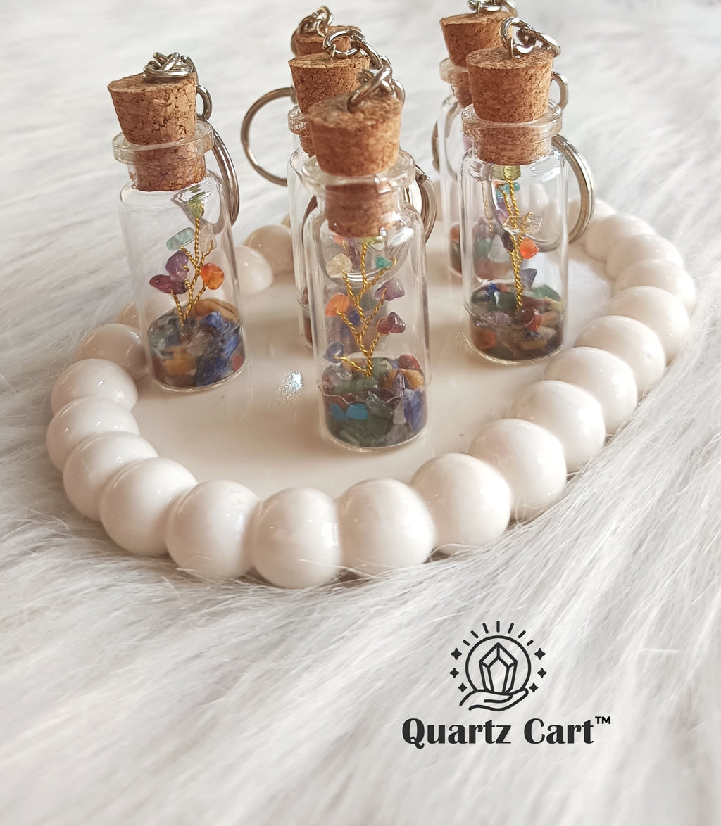 glass bottle keychain filled with colorful stone chips