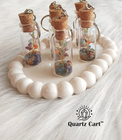 glass bottle keychain filled with colorful stone chips