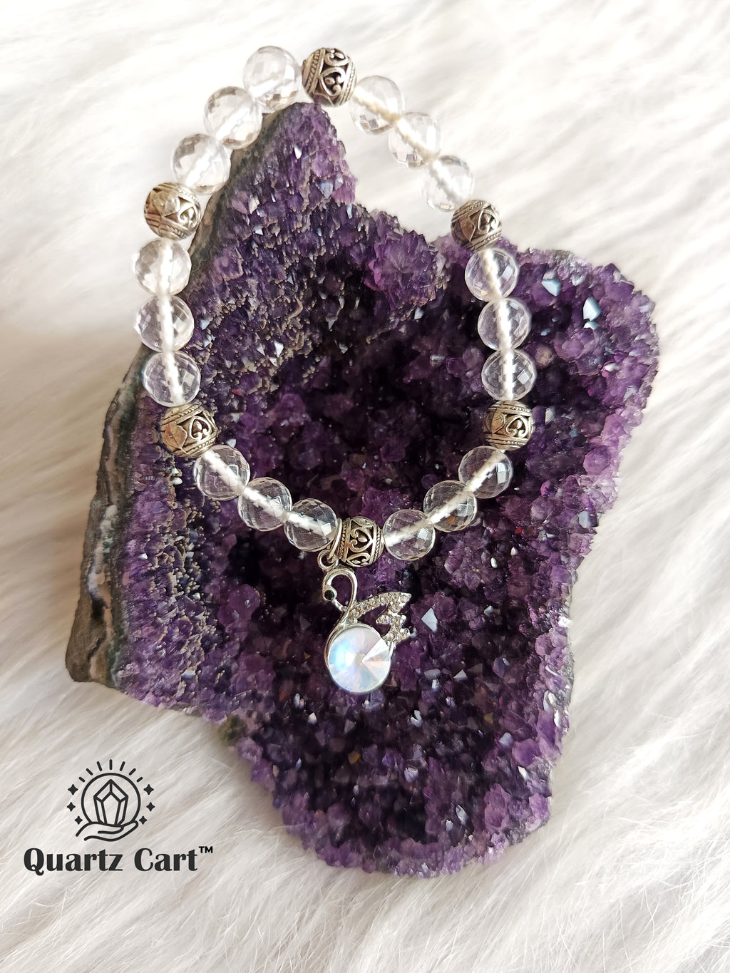 Clear quartz faceted charms bracelet placed on amethyst crystal cluster showing transparent gemstone beads, healing bracelet for clarity and positive energy