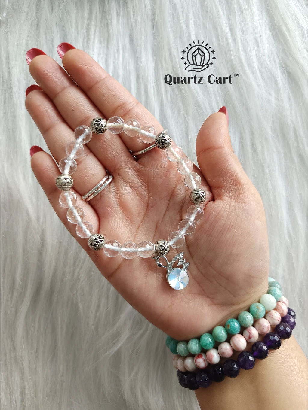 Clear quartz faceted charms bracelet worn on hand displaying sparkling crystal beads and charm, gemstone bracelet for clarity, focus and energy healing