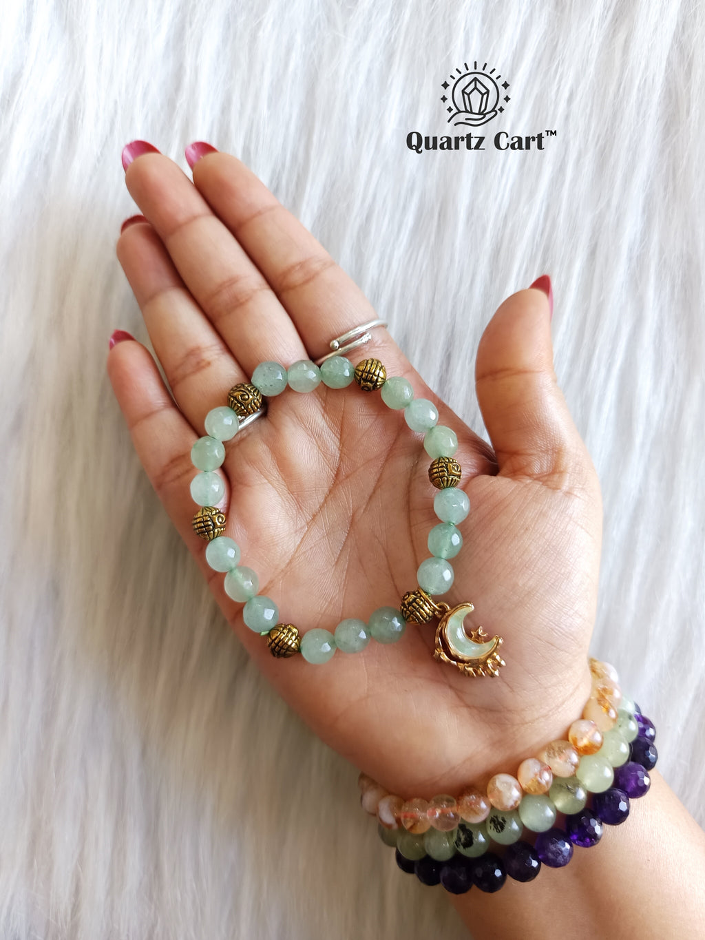 Hand wearing Green Aventurine Charms Healing Crystal Bracelet for luck and prosperity