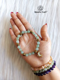 Hand wearing Green Aventurine Charms Healing Crystal Bracelet for luck and prosperity