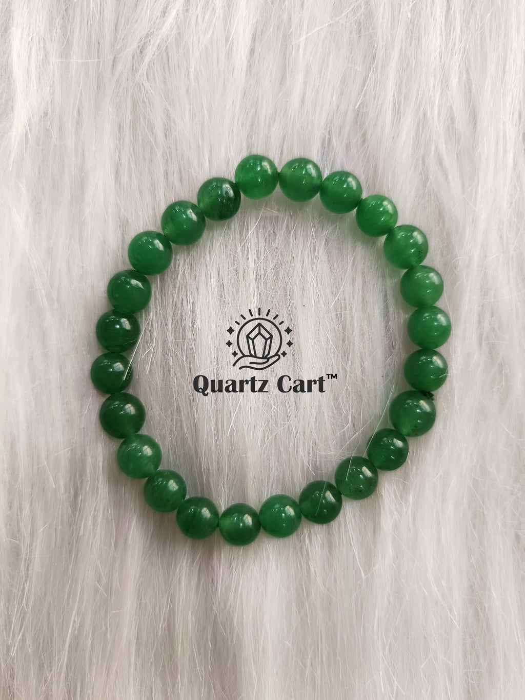 Green jade bracelet 8mm displayed on surface with natural green gemstone beads, crystal bracelet for abundance, harmony and positive energy