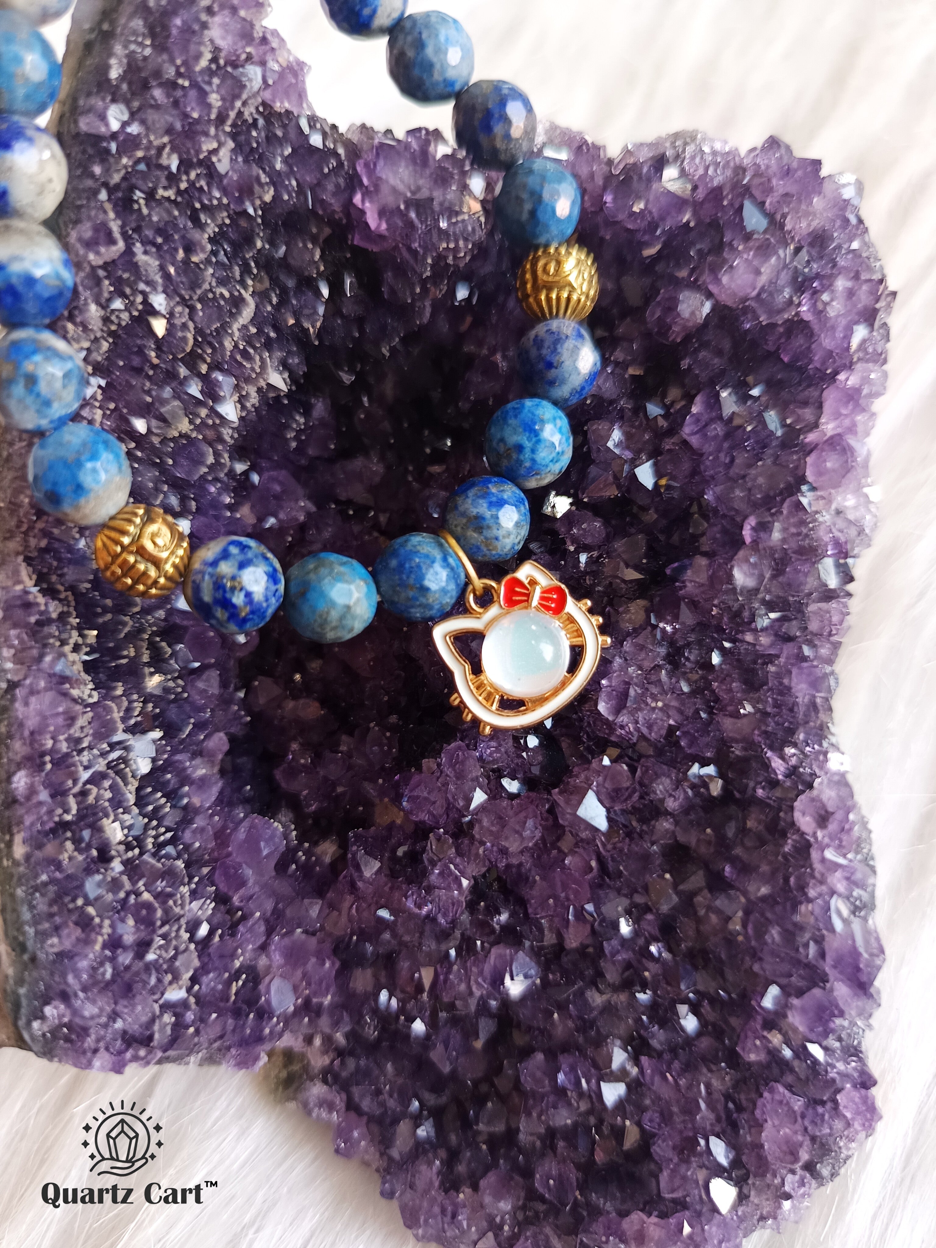 Lapis Lazuli charms kids bracelet displayed on crystal cluster symbolizing wisdom and positive energy