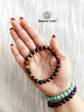 multi tiger eye bracelet on hand showing natural mixed gemstone beads for confidence wealth and protection