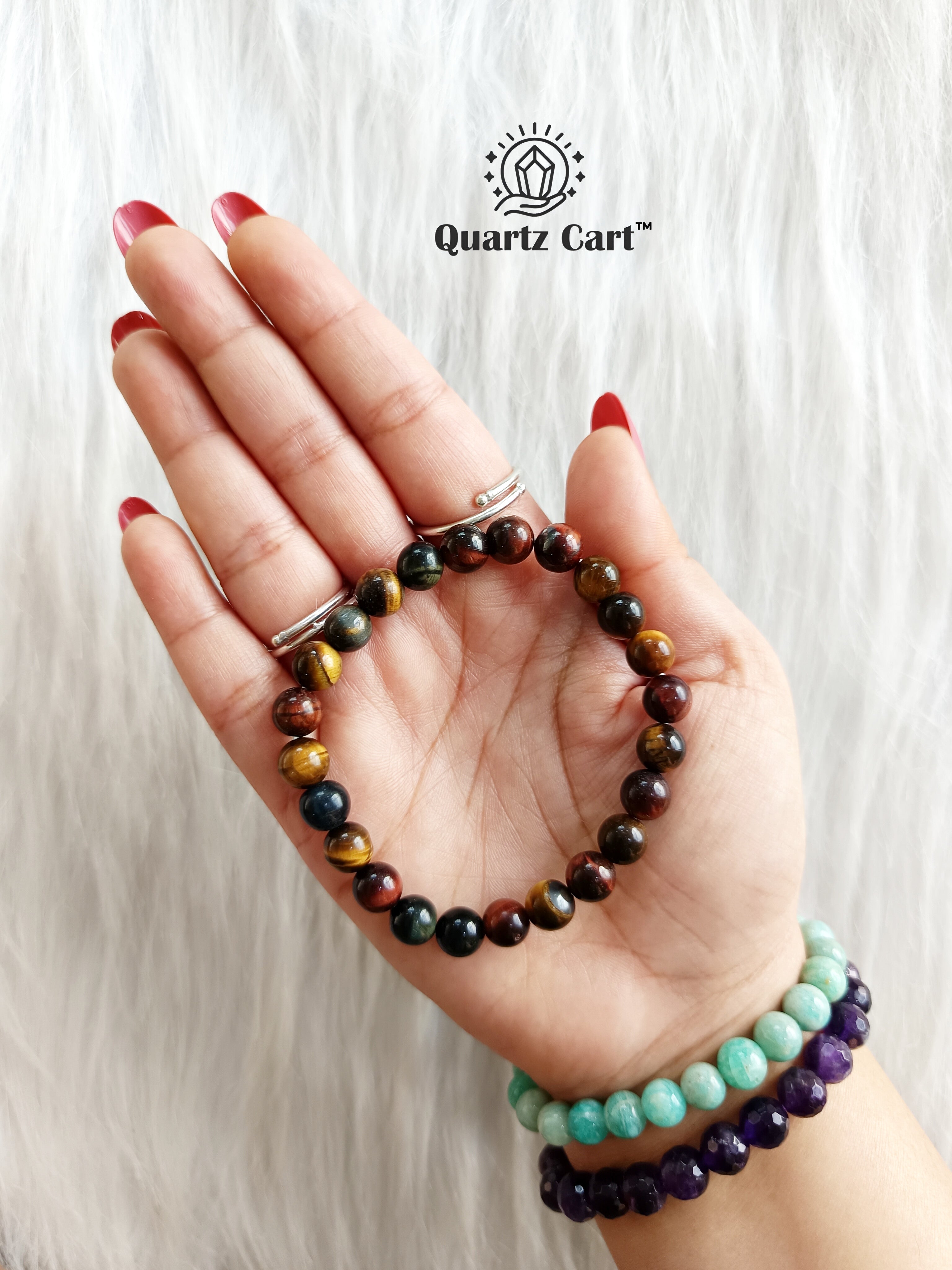 multi tiger eye bracelet on hand showing natural mixed gemstone beads for confidence wealth and protection