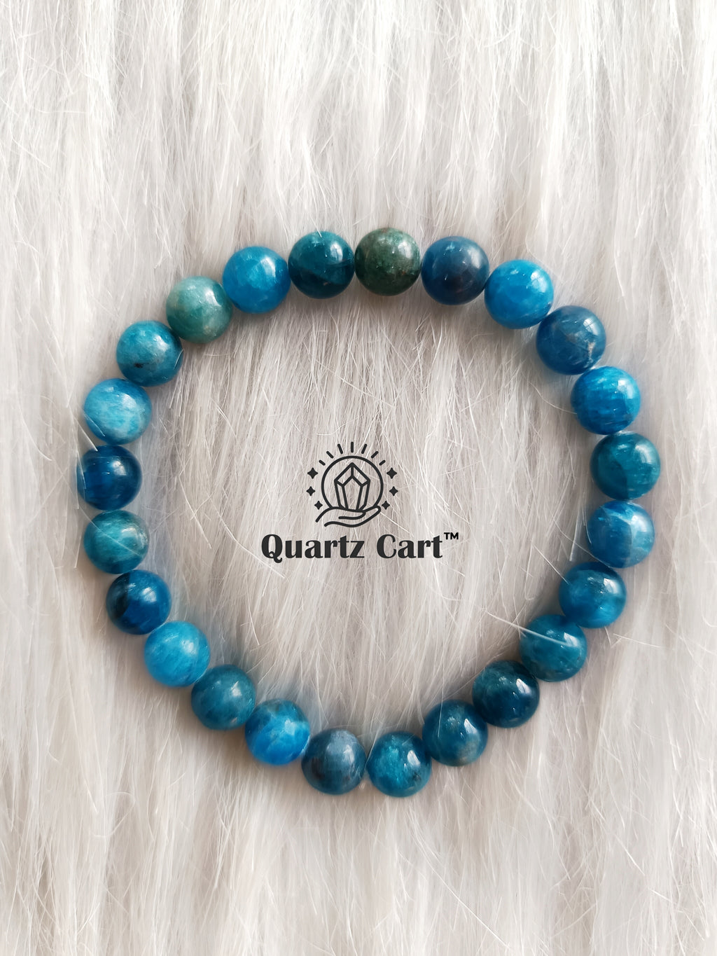 Blue Apatite gemstone bracelet placed on surface highlighting polished beads for healing energy and spiritual balance