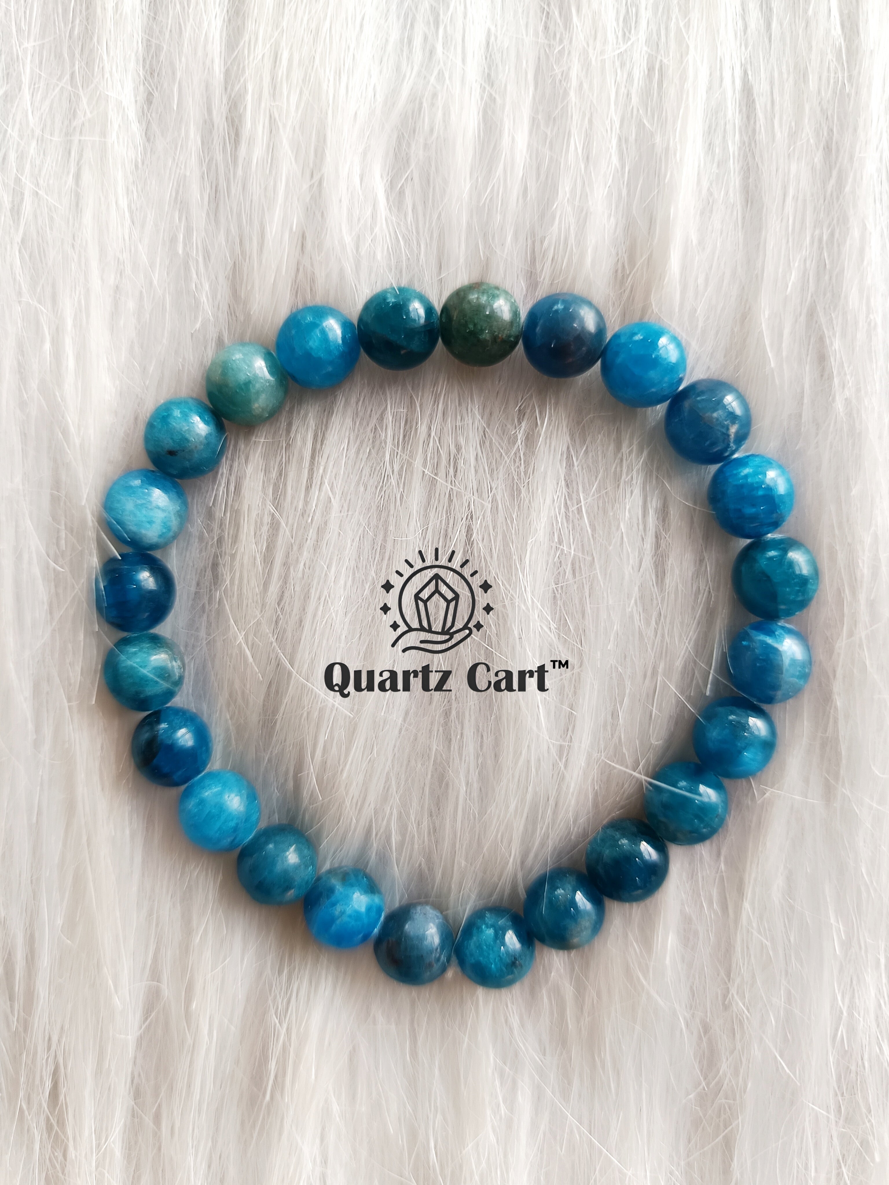Blue Apatite gemstone bracelet placed on surface highlighting polished beads for healing energy and spiritual balance