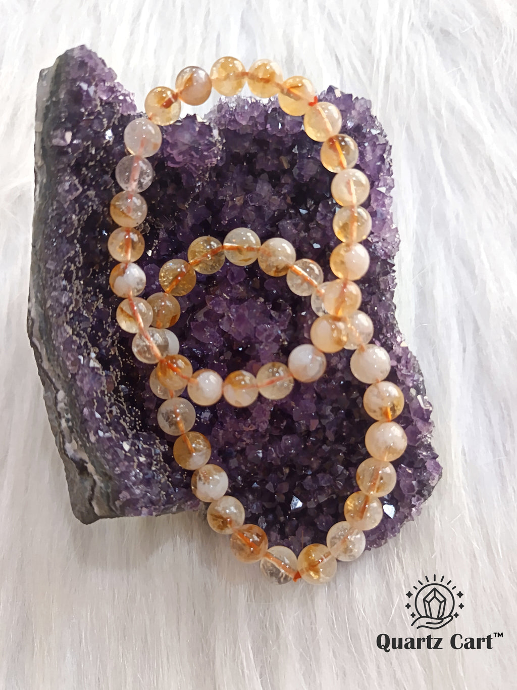 Natural Citrine gemstone bracelet 8mm displayed on crystal cluster symbolizing abundance success and positivity