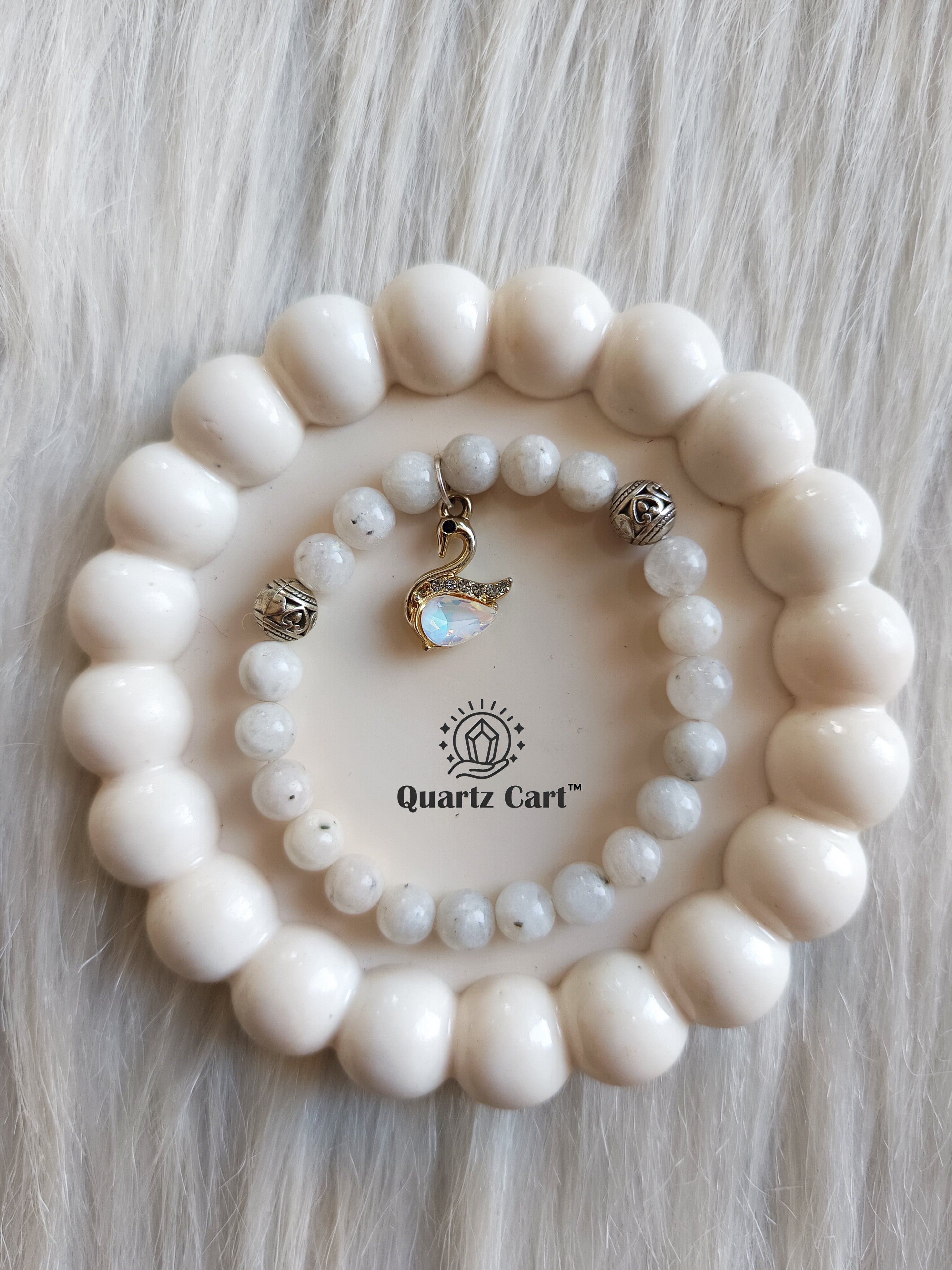 Rainbow moonstone charms bracelet placed on surface showing natural white gemstone beads with charm, crystal bracelet for intuition, emotional balance and calmness