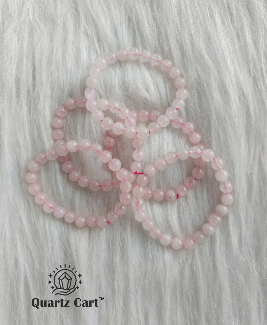 Rose Quartz healing crystal bracelets arranged together representing love harmony and emotional balance