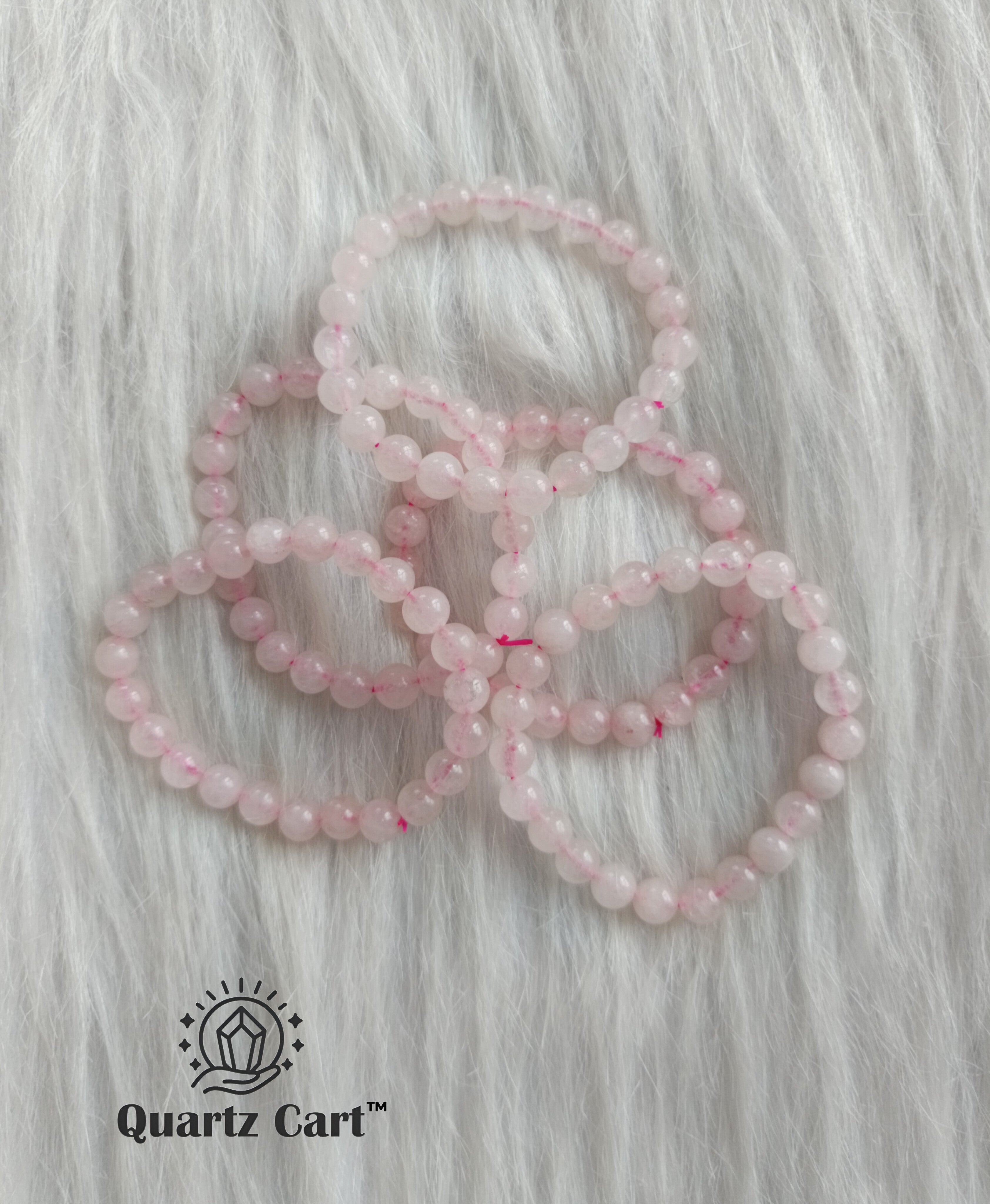 Rose Quartz healing crystal bracelets arranged together representing love harmony and emotional balance