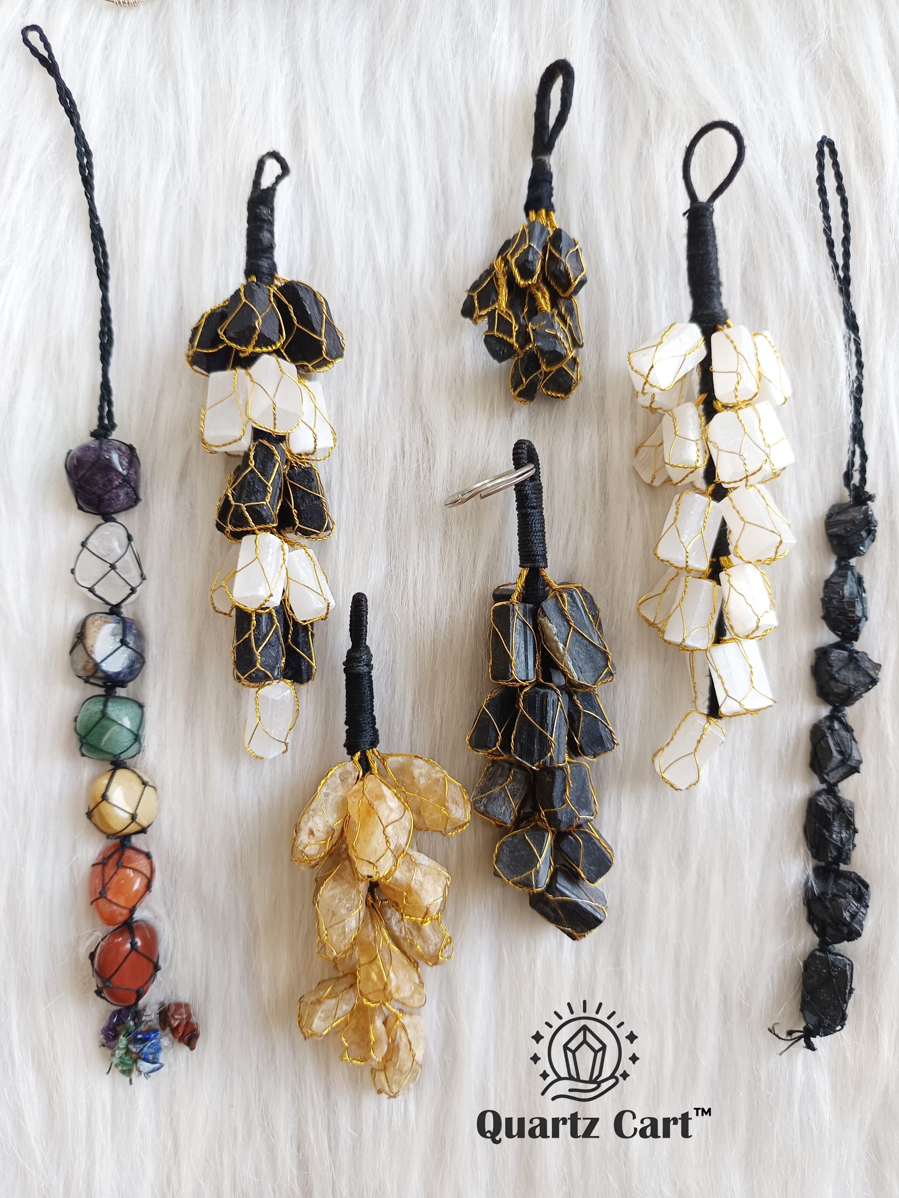 white and black stone chip hanging decor displayed with other hangings