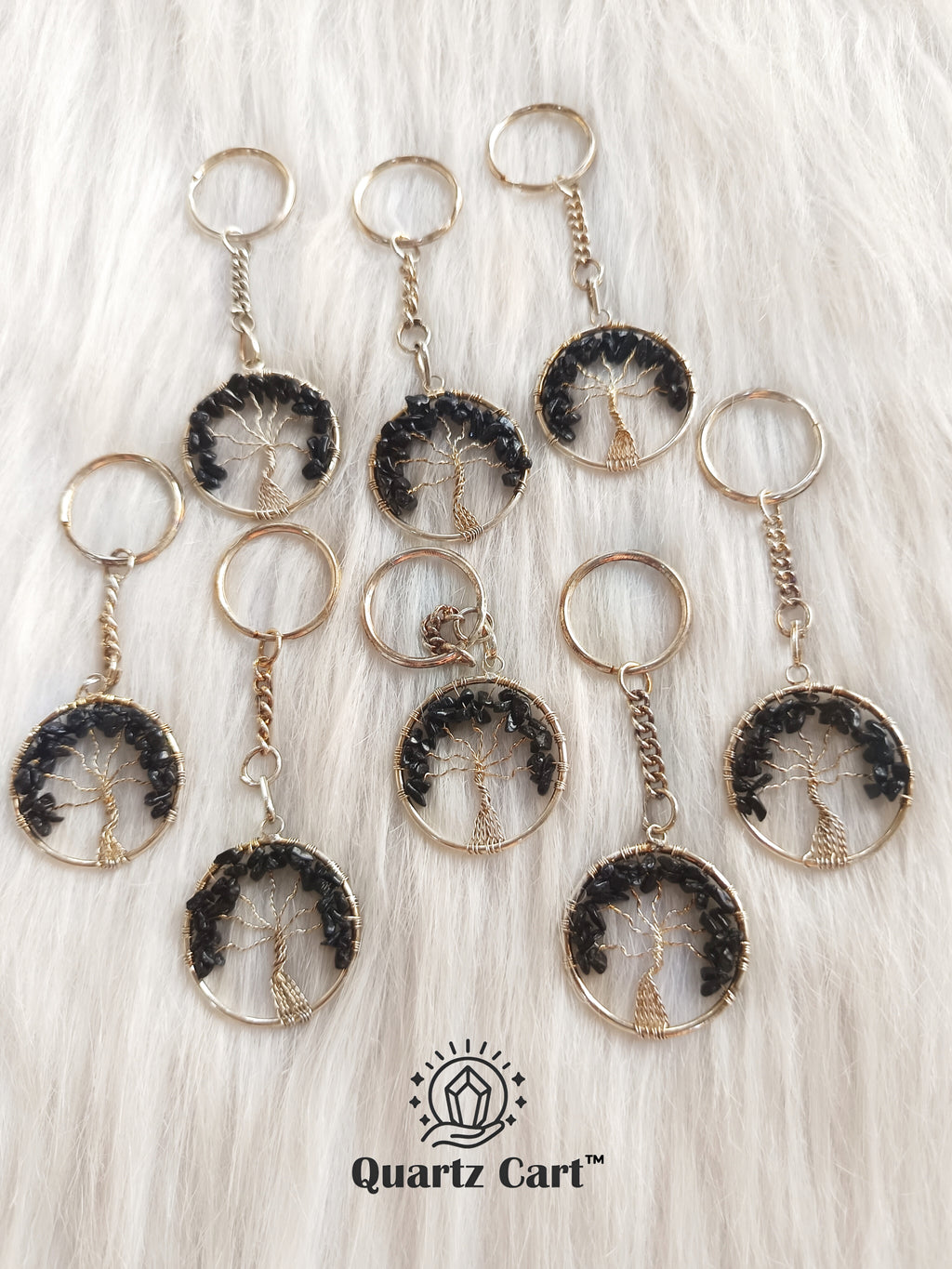 multiple black round stone tree of life keychains