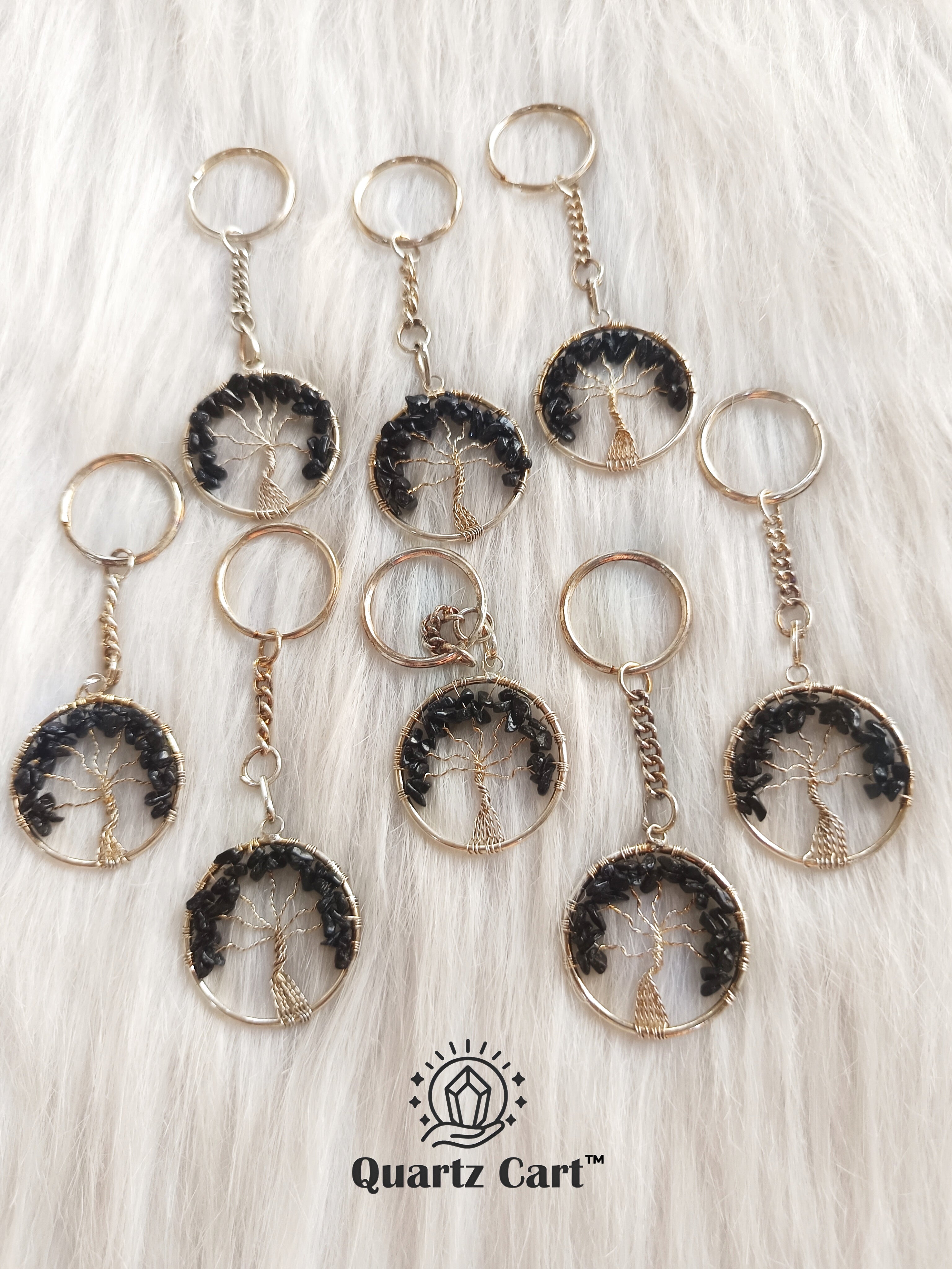multiple black round stone tree of life keychains
