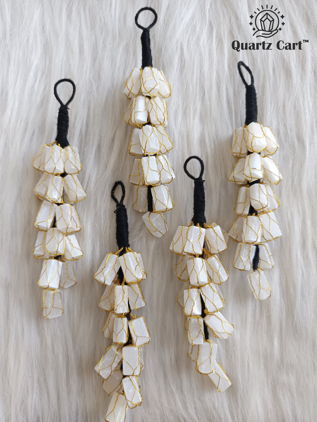 white stone chip layered decorative hanging on white background