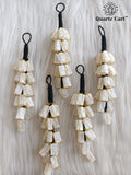 white stone chip layered decorative hanging on white background