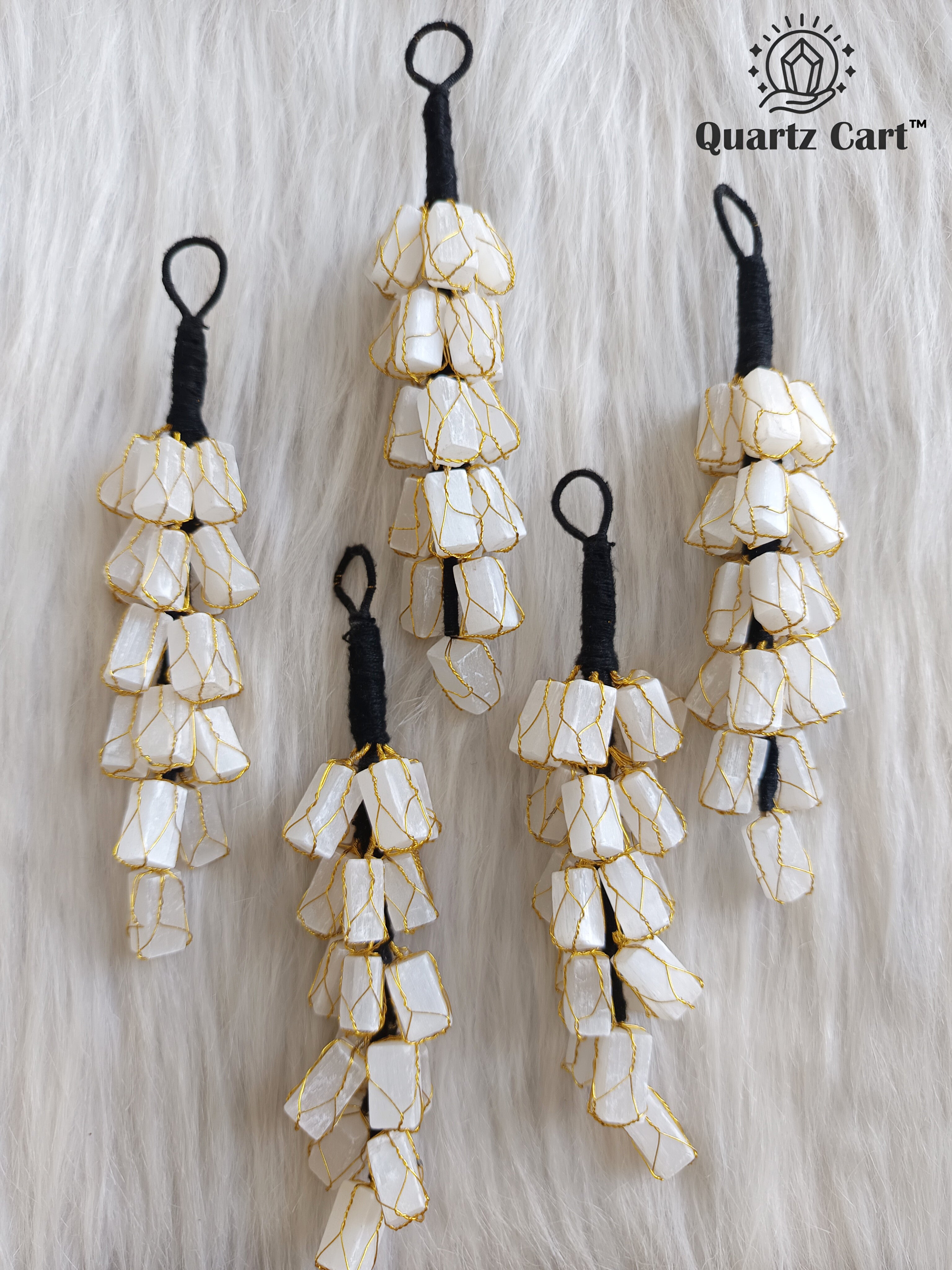 white stone chip layered decorative hanging on white background